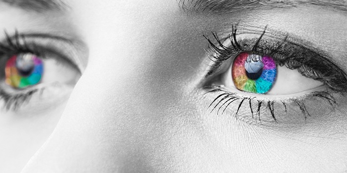 Woman in black and white with rainbow hued irises (MODEL)