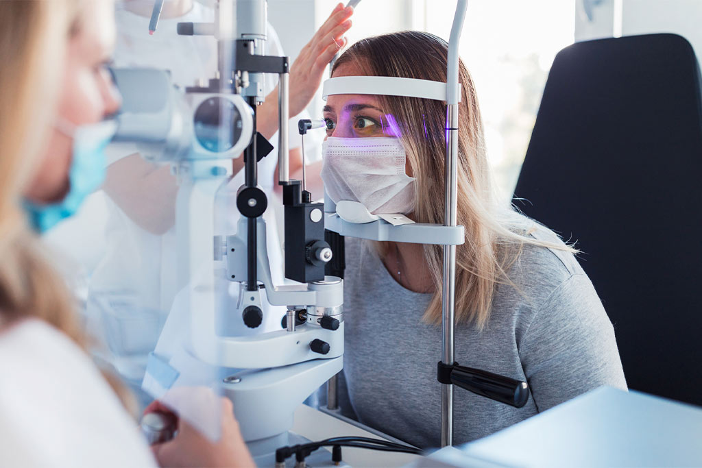 nJoy Vision Oklahoma City LASIK blog post feature image of a woman receiving a comprehensive eye exam from an eye doctor