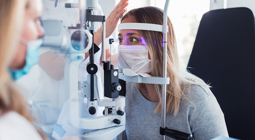 nJoy Vision Eye Health and UV Awareness Month blog image of young woman receiving an eye exam