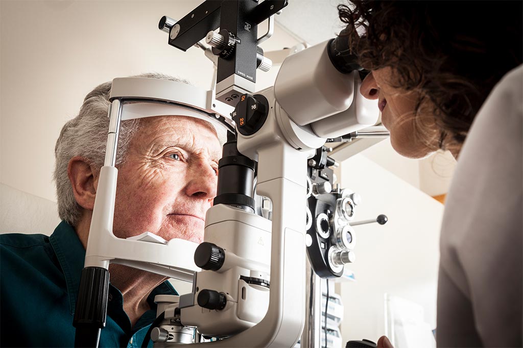 nJoy Vision June is Cataract Awareness Month blog post feature image of an elderly cataract patient receiving an eye exam