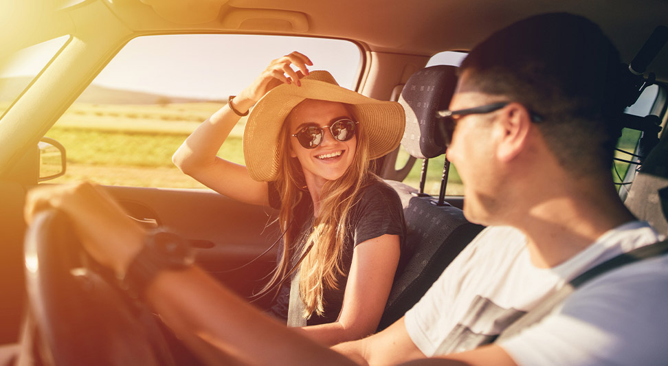 nJoy Vision Summertime is LASIK blog post story image of two young adults roadtripping